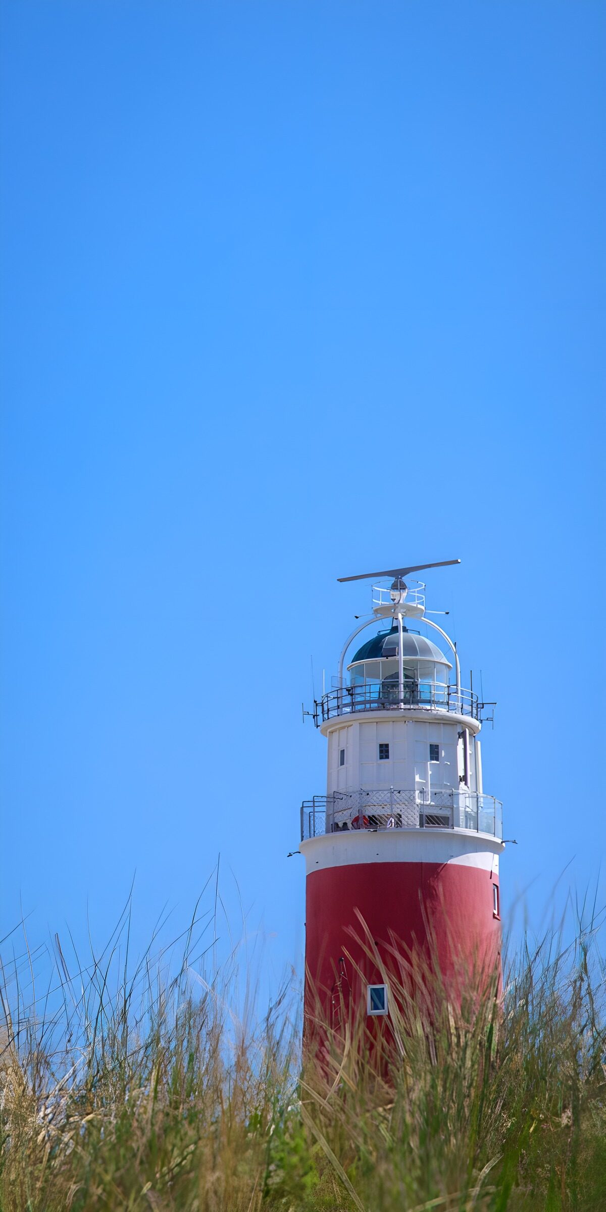 CW5721334: Vuurtoren bij blauwe lucht